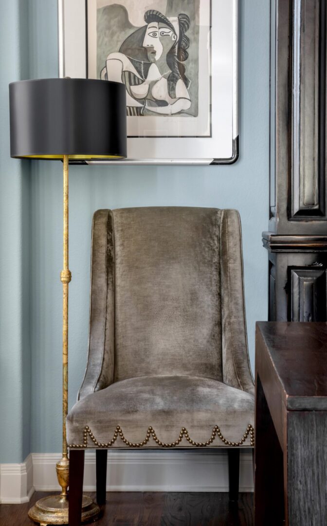 a black color lamp near an armless chair