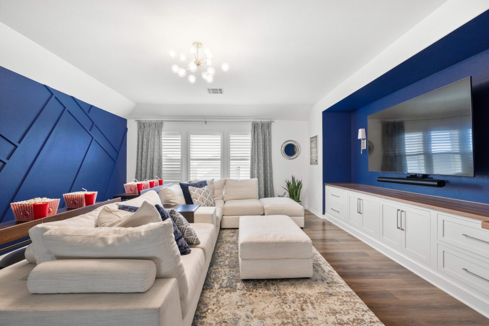 a living room with blue and white theme