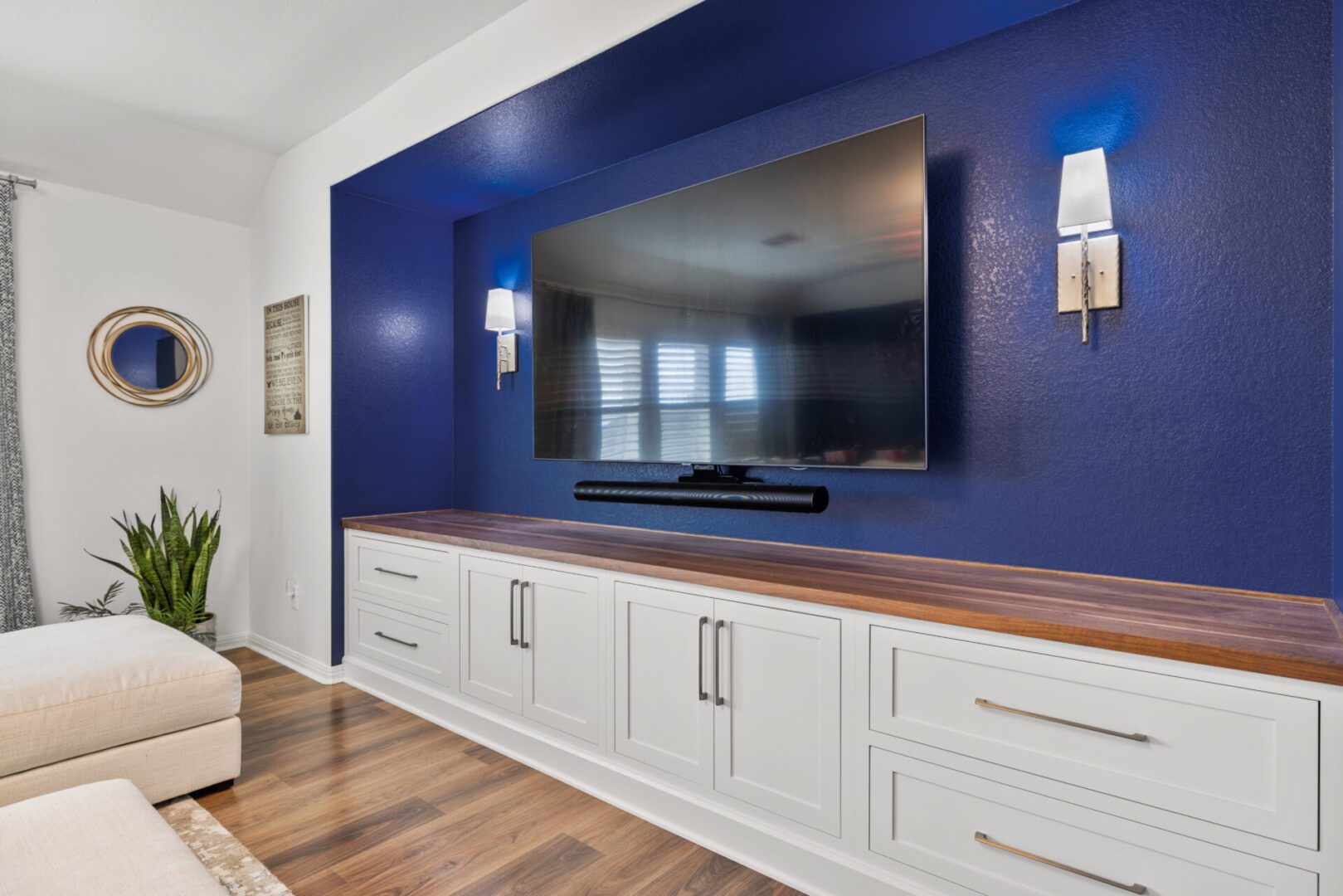 LED TV on a blue color wall with lights